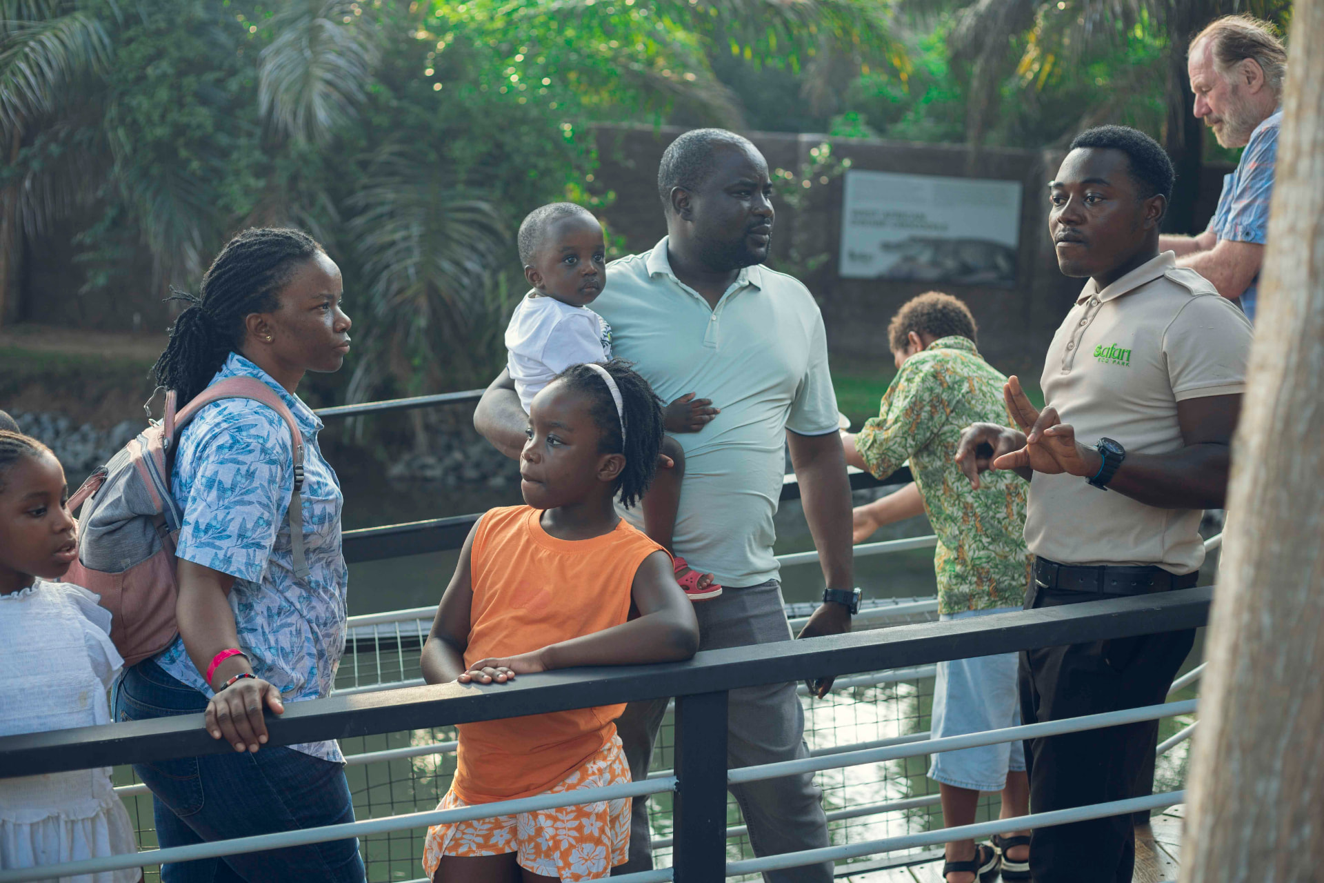 A guide briefing guests on a walkway